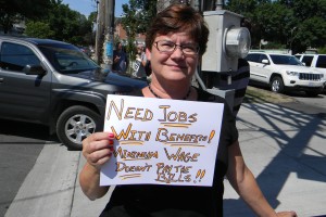 Perry protester holding sign