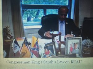 King with confederate flag on his desk