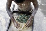 Youth cleaning cobalt Photo Credit - Getty Images
